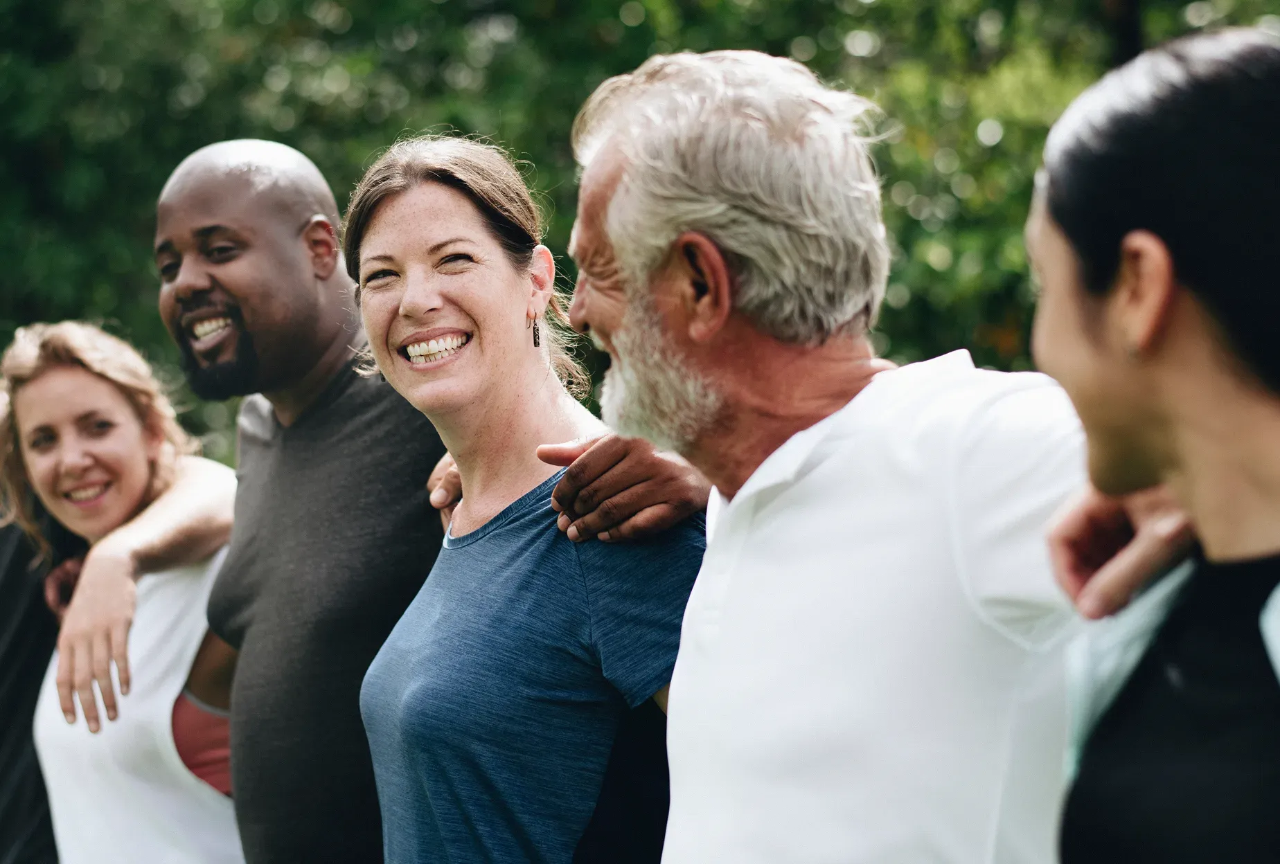 Community members smiling together outdoors
